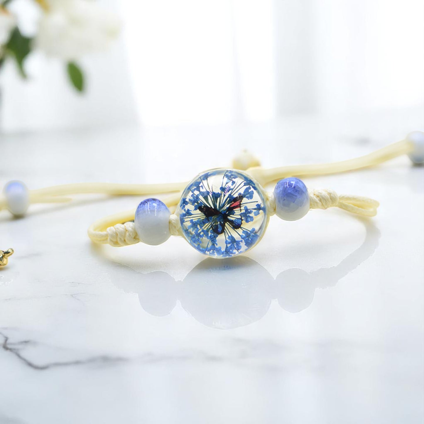 Handmade Butterfly Charm Bracelet with Floral Resin Center, Floral butterfly jewelry, Nature-inspired jewelry, Whimsical bracelet design, Delicate handmade jewelry