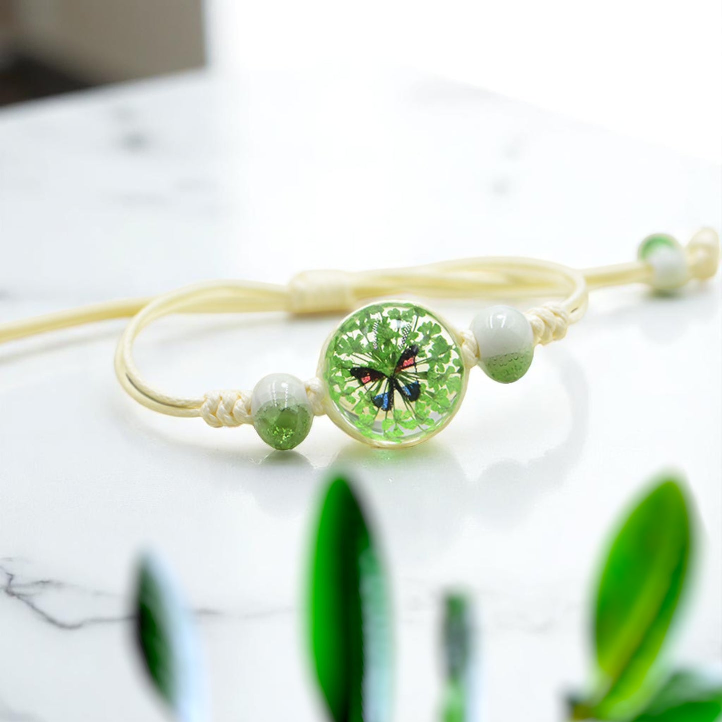 Handmade Butterfly Charm Bracelet with Floral Resin Center, Floral butterfly jewelry, Nature-inspired jewelry, Whimsical bracelet design, Delicate handmade jewelry