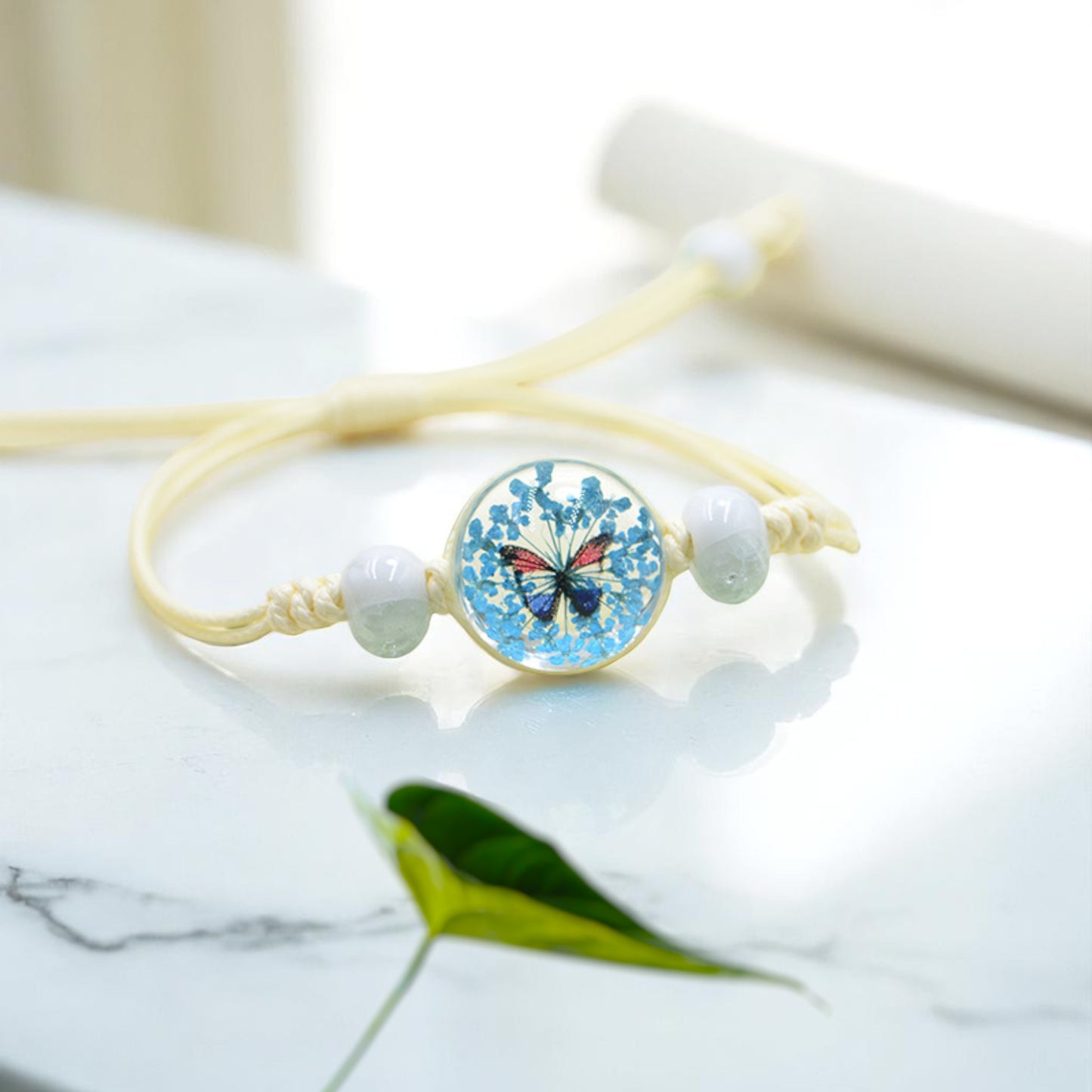 Handmade Butterfly Charm Bracelet with Floral Resin Center, Floral butterfly jewelry, Nature-inspired jewelry, Whimsical bracelet design, Delicate handmade jewelry