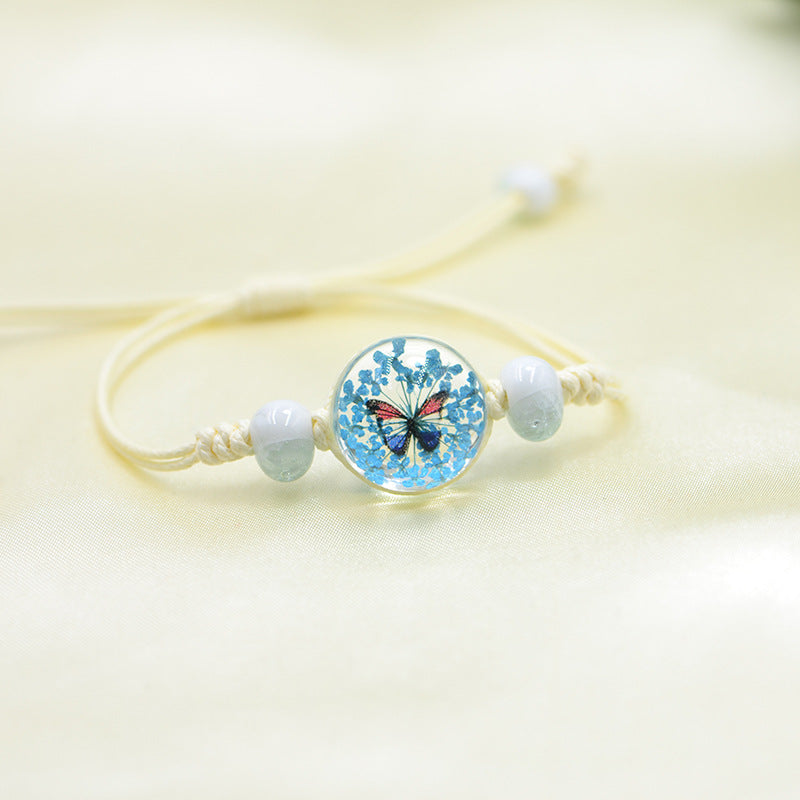 Handmade Butterfly Charm Bracelet with Floral Resin Center, Floral butterfly jewelry, Nature-inspired jewelry, Whimsical bracelet design, Delicate handmade jewelry