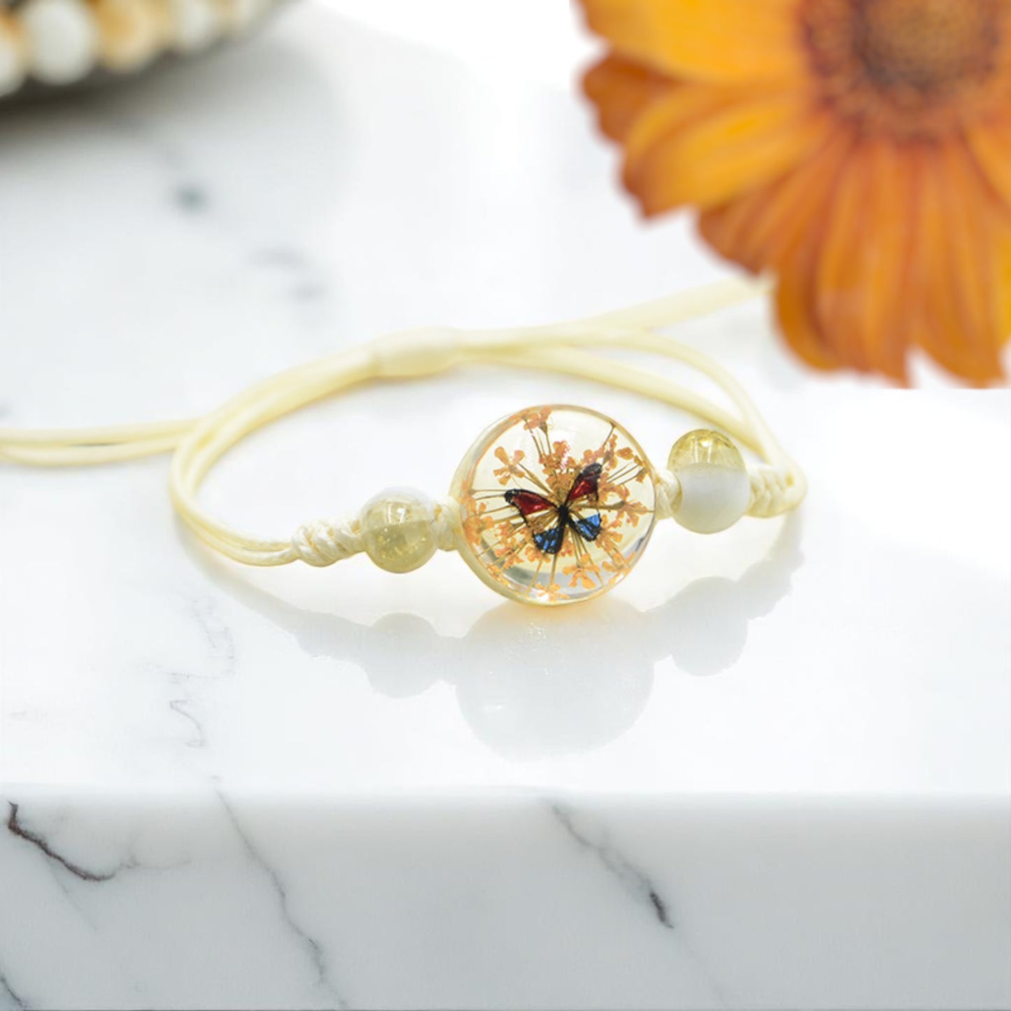 Handmade Butterfly Charm Bracelet with Floral Resin Center, Floral butterfly jewelry, Nature-inspired jewelry, Whimsical bracelet design, Delicate handmade jewelry