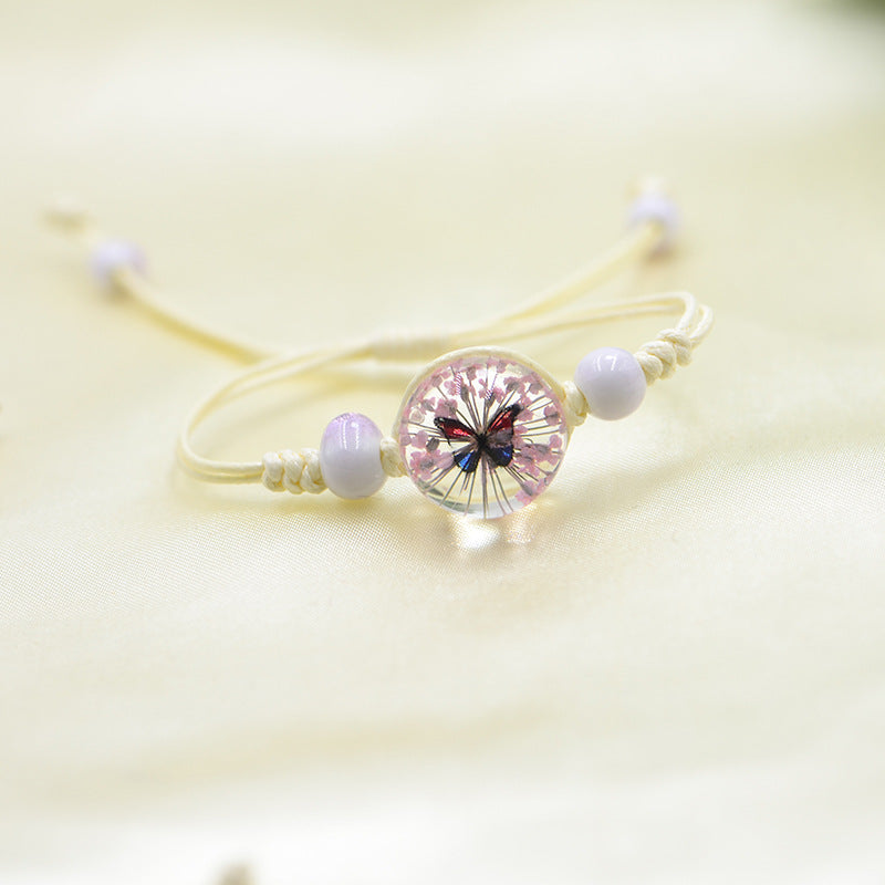 Handmade Butterfly Charm Bracelet with Floral Resin Center, Floral butterfly jewelry, Nature-inspired jewelry, Whimsical bracelet design, Delicate handmade jewelry