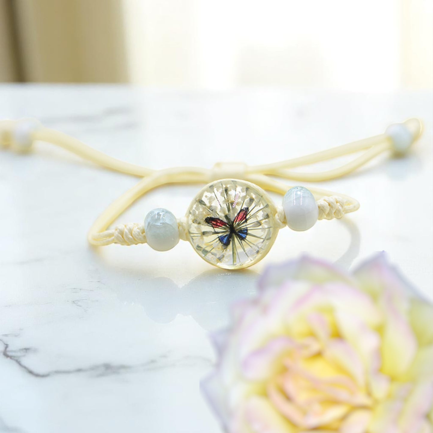Handmade Butterfly Charm Bracelet with Floral Resin Center, Floral butterfly jewelry, Nature-inspired jewelry, Whimsical bracelet design, Delicate handmade jewelry