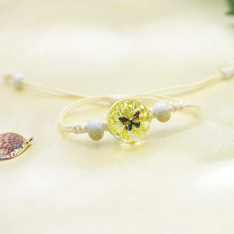 Handmade Butterfly Charm Bracelet with Floral Resin Center, Floral butterfly jewelry, Nature-inspired jewelry, Whimsical bracelet design, Delicate handmade jewelry