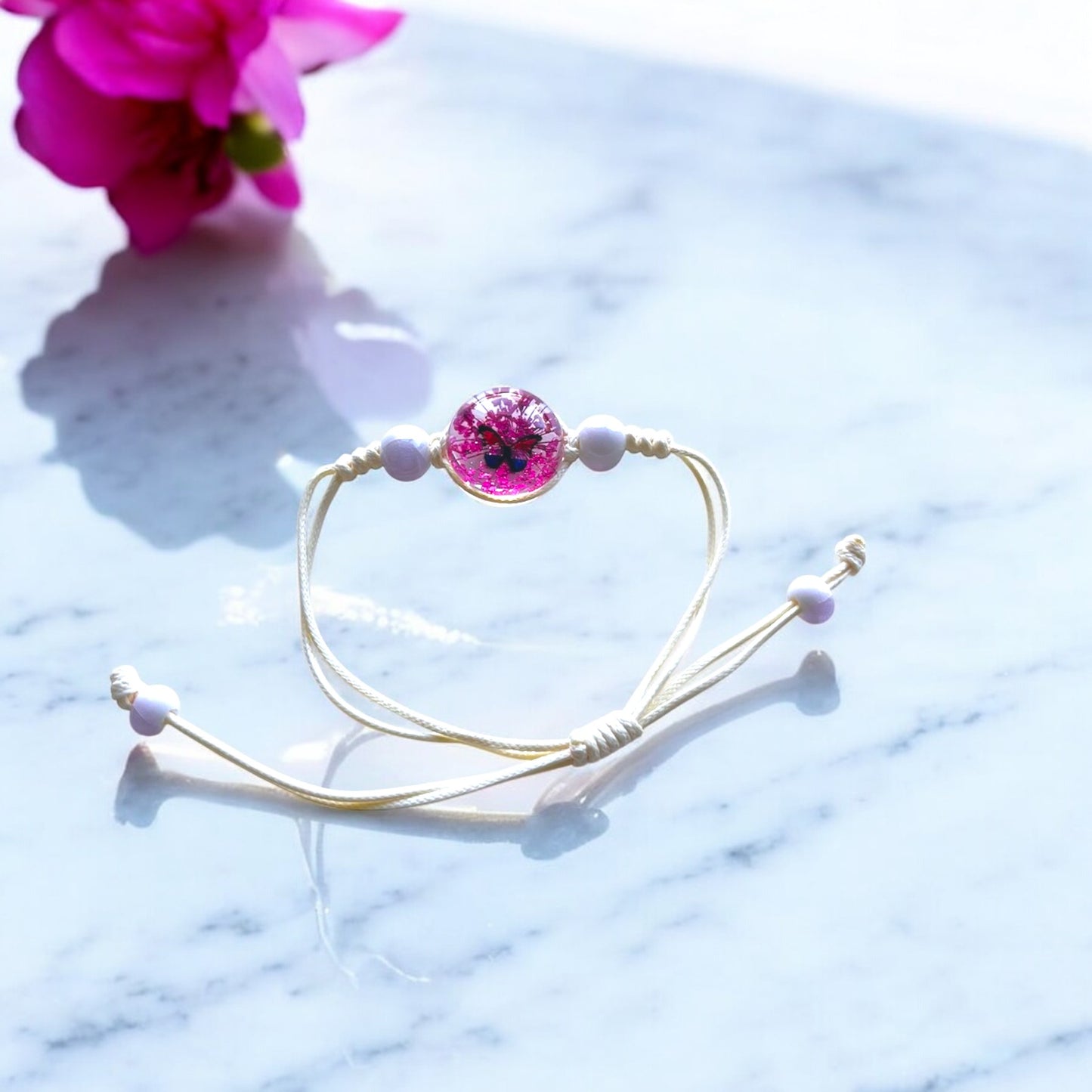 Handmade Butterfly Charm Bracelet with Floral Resin Center, Floral butterfly jewelry, Nature-inspired jewelry, Whimsical bracelet design, Delicate handmade jewelry