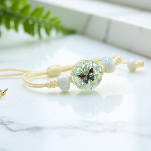 Handmade Butterfly Charm Bracelet with Floral Resin Center, Floral butterfly jewelry, Nature-inspired jewelry, Whimsical bracelet design, Delicate handmade jewelry