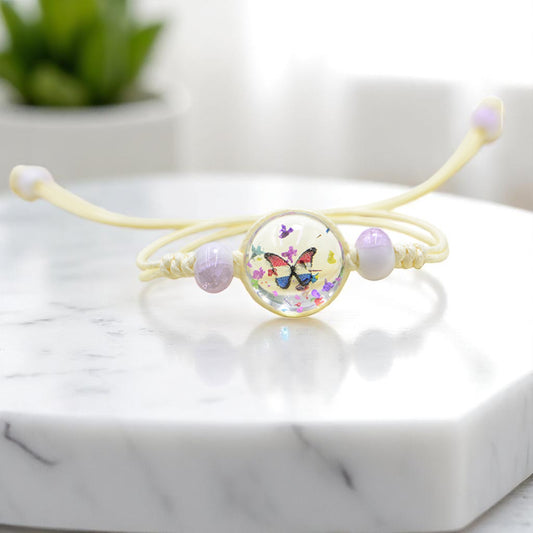 Handmade Butterfly Charm Bracelet with Floral Resin Center, Floral butterfly jewelry, Nature-inspired jewelry, Whimsical bracelet design, Delicate handmade jewelry