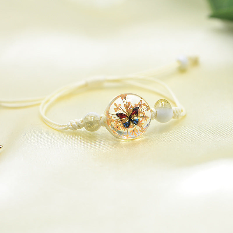 Handmade Butterfly Charm Bracelet with Floral Resin Center, Floral butterfly jewelry, Nature-inspired jewelry, Whimsical bracelet design, Delicate handmade jewelry